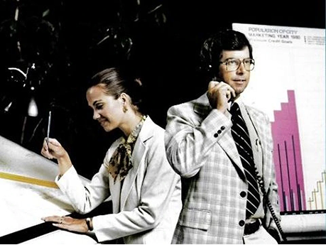 1980s man on the phone and woman holding a pen