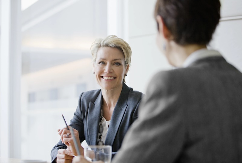 Smiling businesswomen in meeting