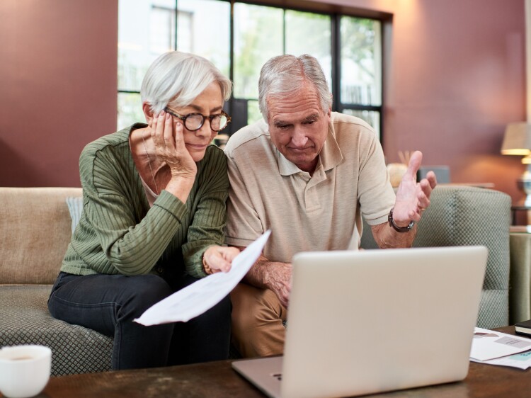 Senior couple looking at computer