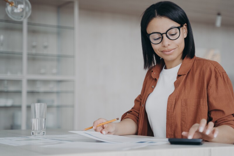 Woman working with calculator