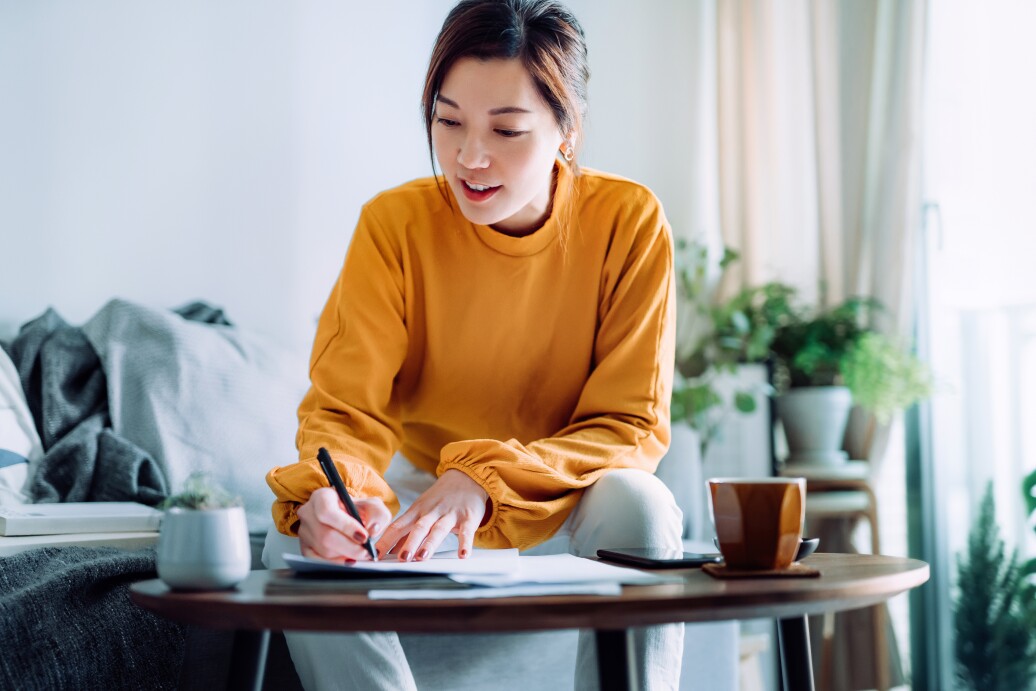 Woman signing papers