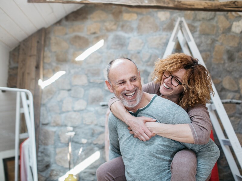 Man carrying his wife on his back