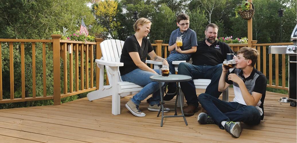 Family enjoys time together on their deck.