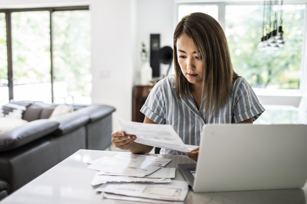 Woman paying bills at computer