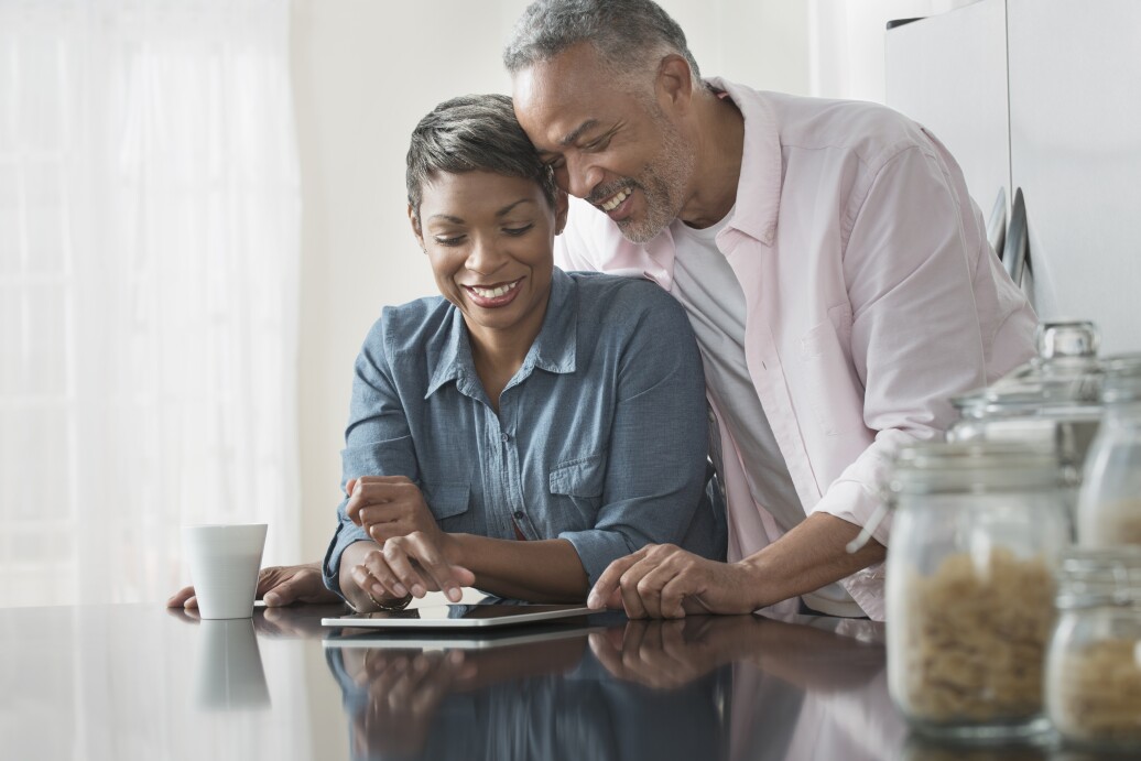 Couple using digital tablet