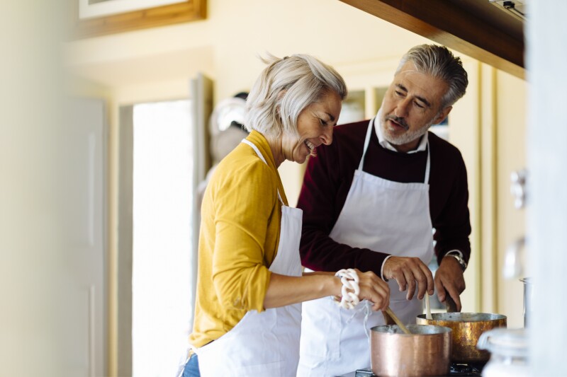 Mature Couple Cooking Together At Home