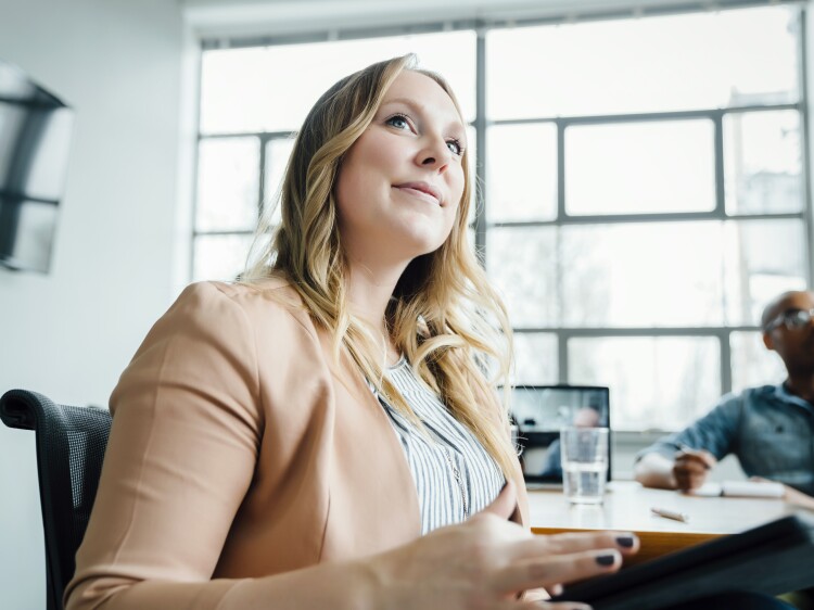 Businesswoman listening in meeting