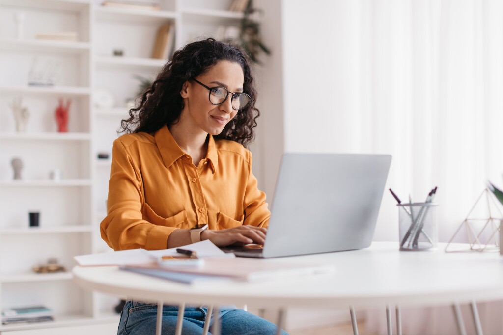 Woman Using Laptop Working Online Sitting In Office