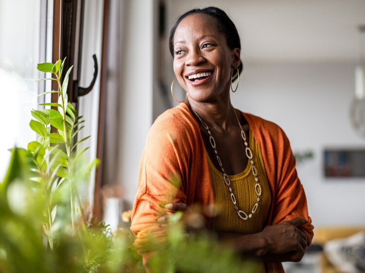 Woman smiling looking out the window