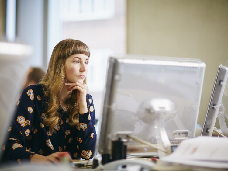 Young woman looking at a computer screen
