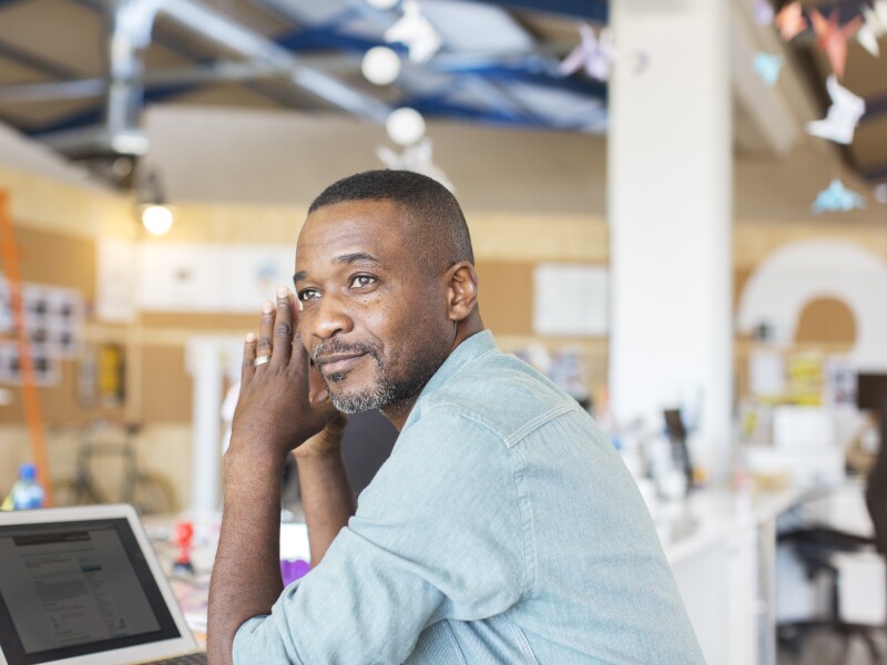 Businessman using laptop in office