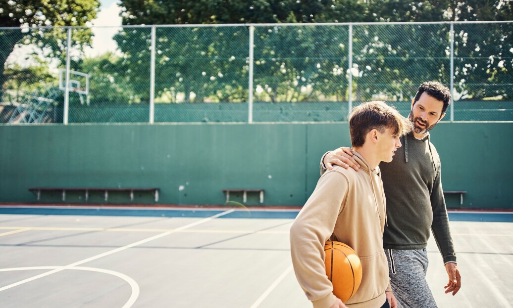 Father and son on basketball court