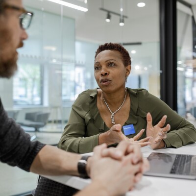 Manager meeting, talking with client in bank branch