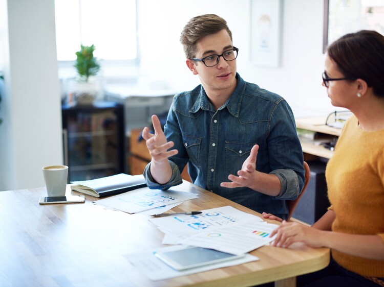 Cropped shot of a man and a woman having a discussion in an office