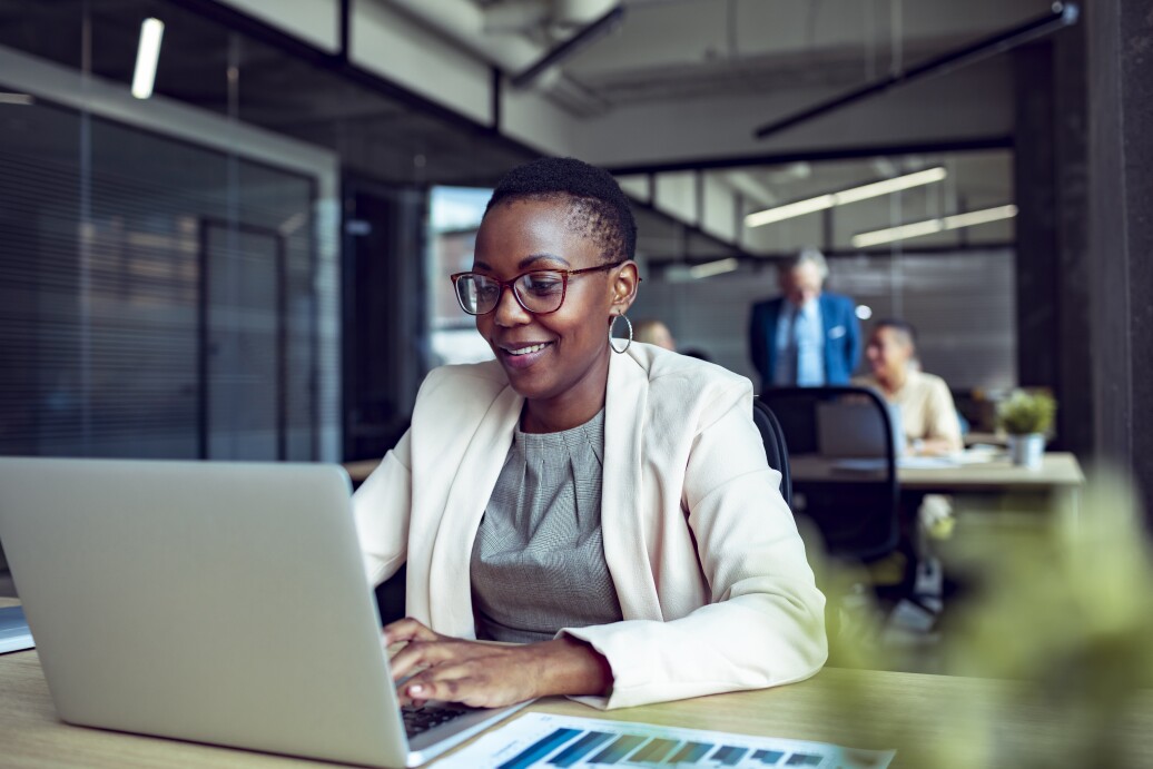Close up of a young businesswoman working in an office