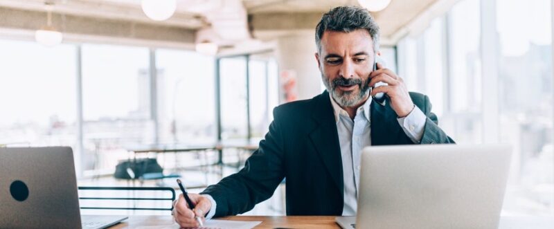 Business man on phone and laptop