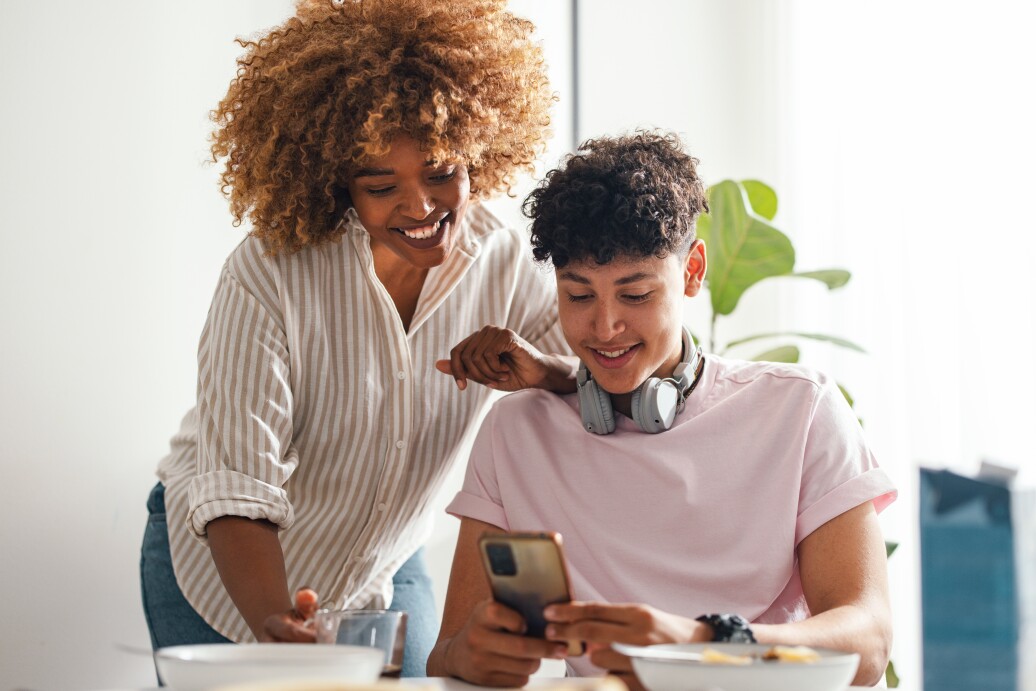 Mom and son looking at phone