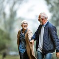 Playful senior couple having fun in the park.