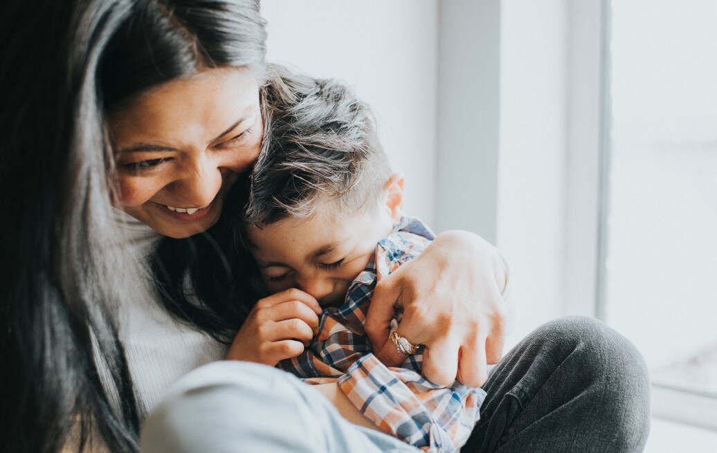 Mother and son cuddling