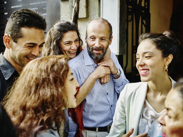 Family talking and laughing during party