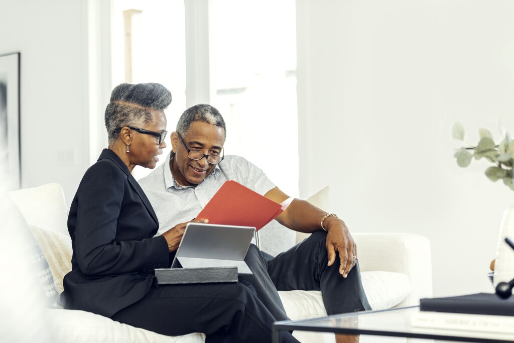 Man meeting with financial advisor at home
