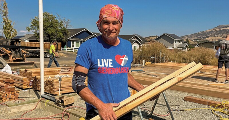 A man helps with rebuilding efforts in Rogue Valley, Oregon.