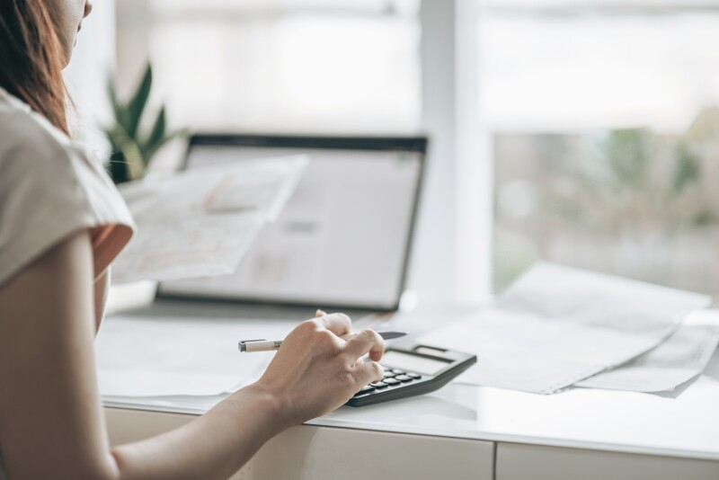 Woman using calculator
