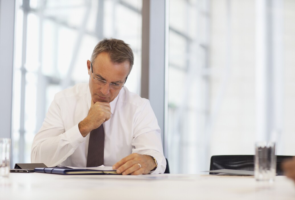 Man in a tie reading