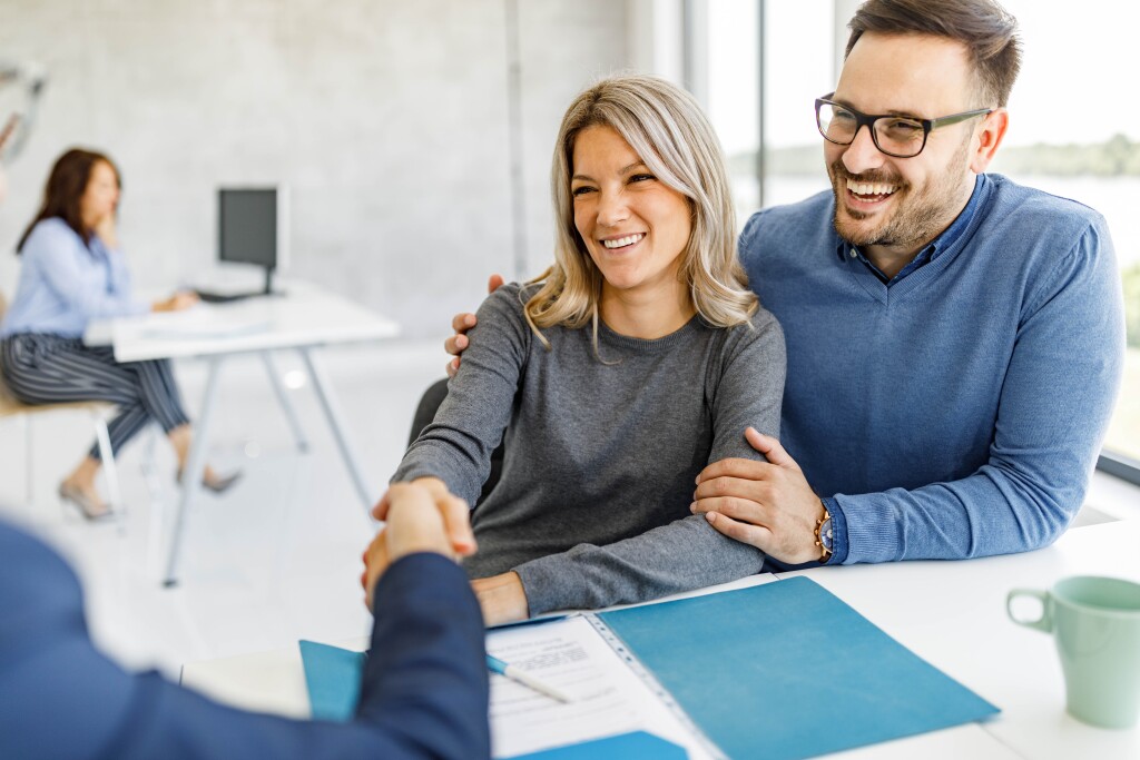 Couple came to an agreement with their financial advisor in the office.