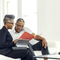 Man meeting with financial advisor at home