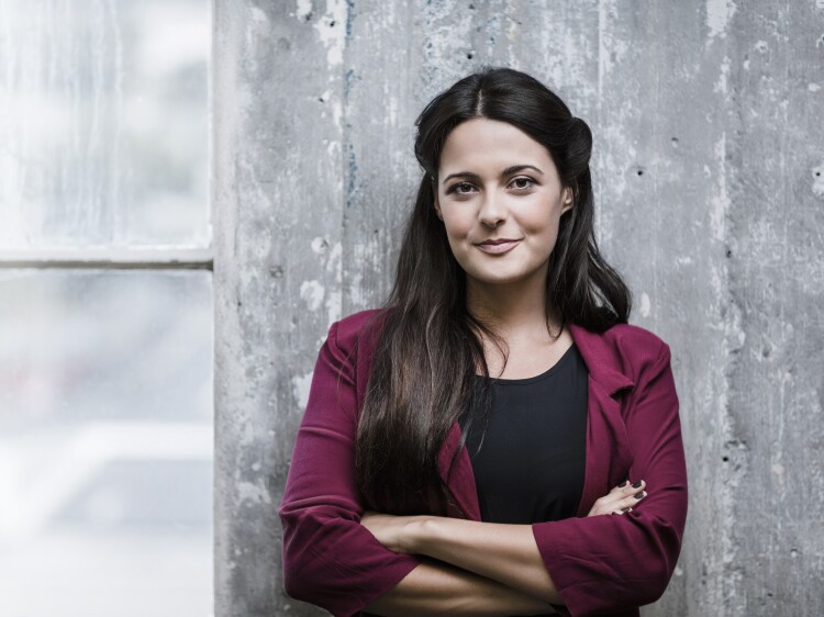 Confident businessman standing in office