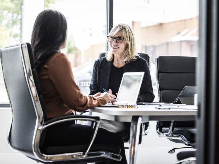 Two women in a conference room