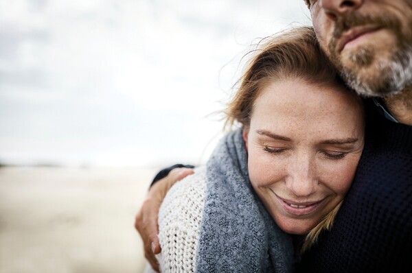 Couple hugging on the beach