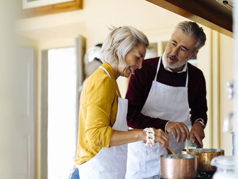 Mature Couple Cooking Together At Home