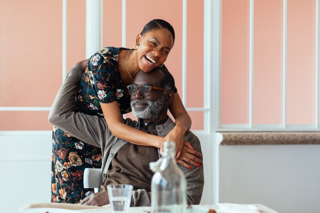 Father and daughter enjoying a meal together.