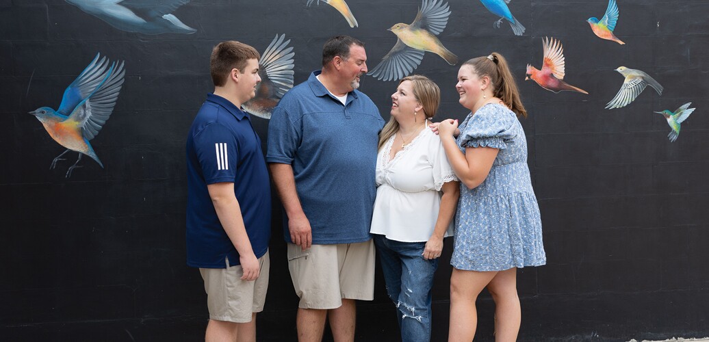 Family poses for a photo.