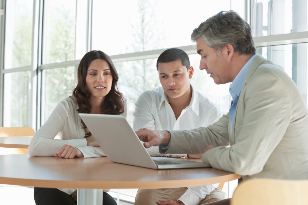 Financial advisor explaining investment options to a couple