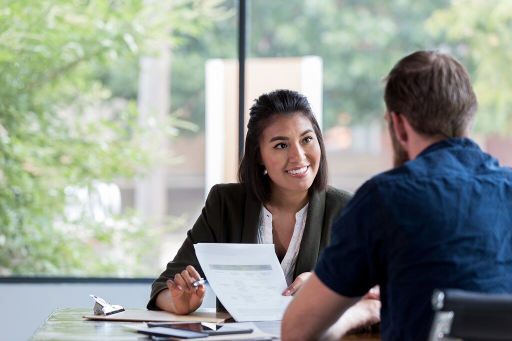 Financial advisor meets with a client in the office