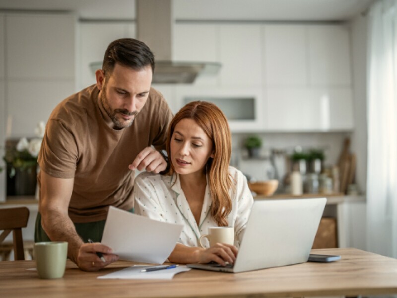 Your Will and Estate Planning Guide with illustration of man walking atop a large hand to cross from one cliff to another
