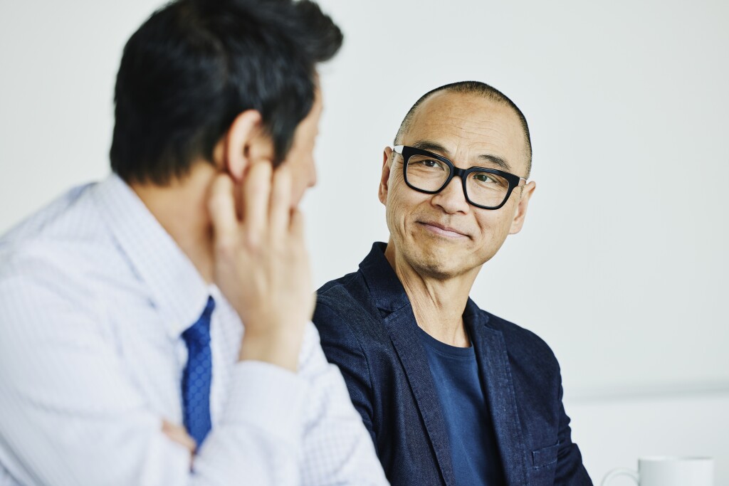 Shot of a businessman listening to a financial advisor during meeting in office