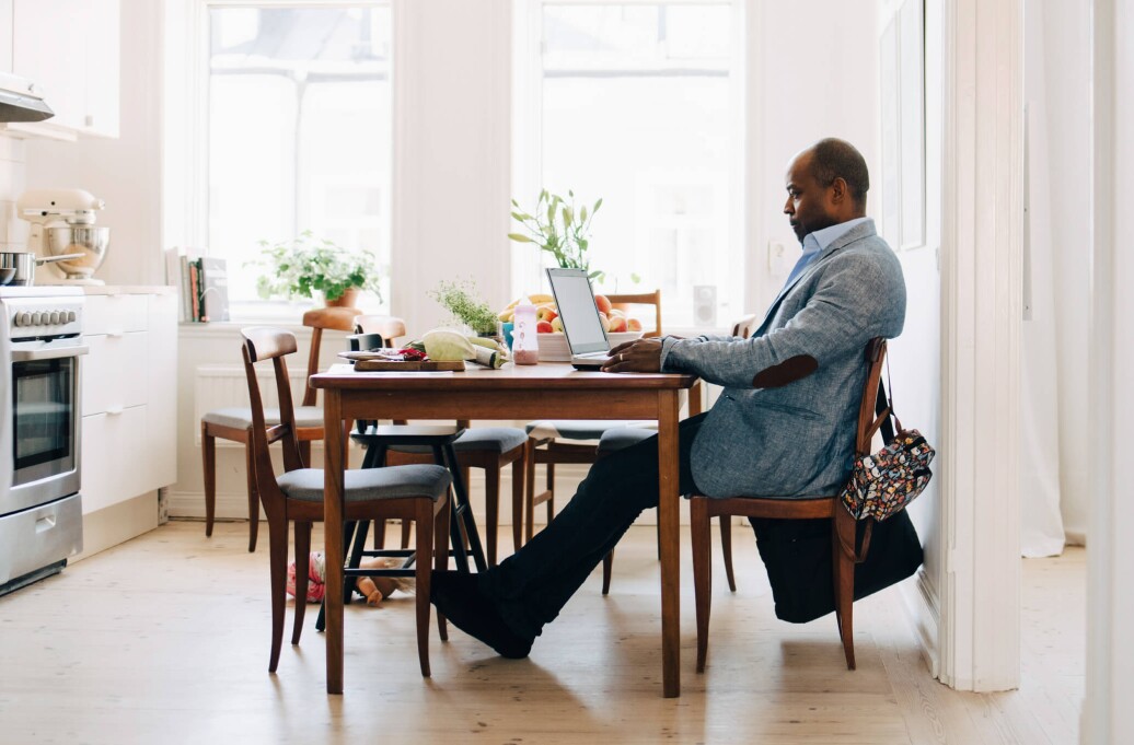 Advisor working at kitchen table