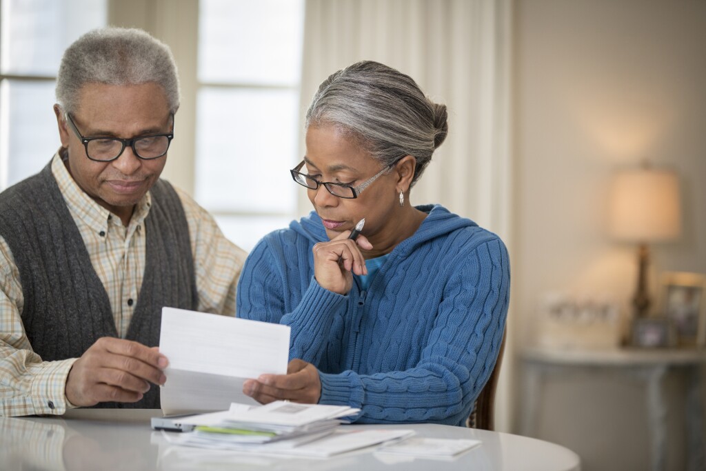 Senior African American couple looking over paperwork