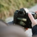 Man taking a picture with a digital camera