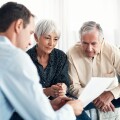 Shot of a senior couple getting advice from their financial advisor at home