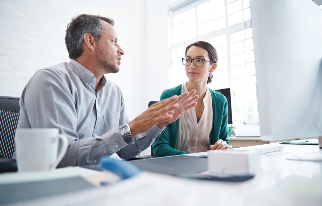 Two people in a meeting