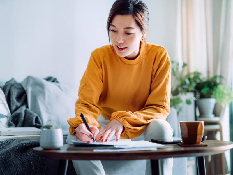 Woman signing document