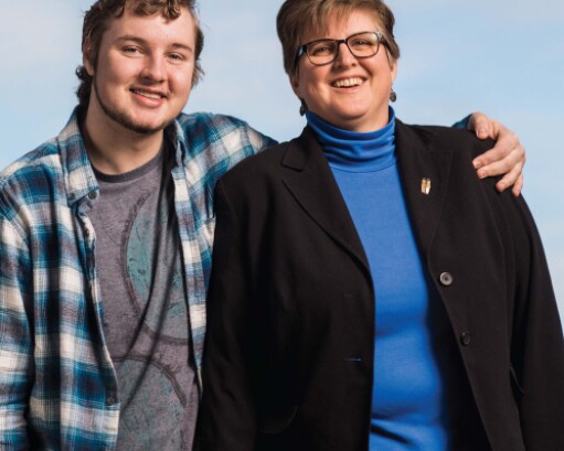 Son with his arm around his mom's shoulder