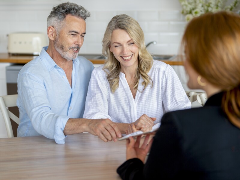 Couple in 50s in meeting