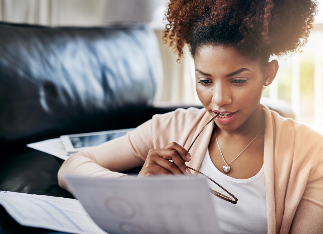 Young women going through her paperwork at home