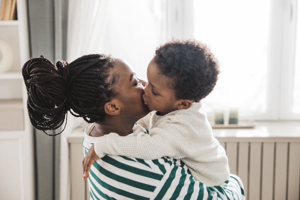 Mom and toddler hug